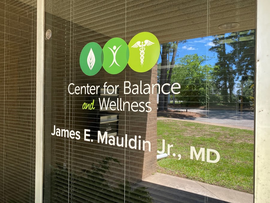 Center for balance and wellness logo on the door of the clinic